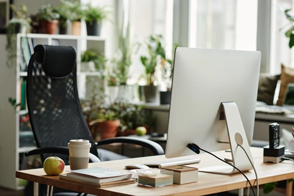 A well-organized wooden office desk is arranged according to feng shui principles A well-organized wooden office desk is arranged according to feng shui principles