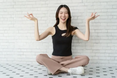 Young woman practicing simple meditation in a well-lit room for home harmony
