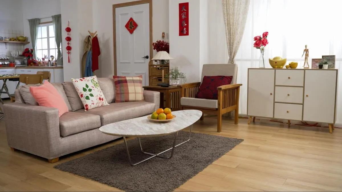 Using Feng Shui Elements in Interior Design A modern living room incorporating the five Feng Shui elements: wood frames, metal accents, and earth-colored rugs for harmony.